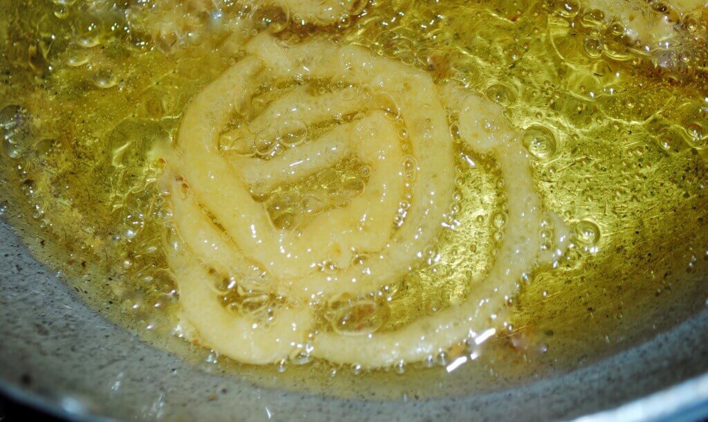Jalebi swirls in Boiling Oil-